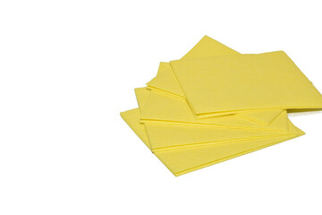 On a white background there are yellow viscose napkins to remove dust, moisture and dirt.