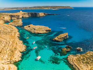 Aerial view of Comino island, Blue lagoon, boats. Maltese island