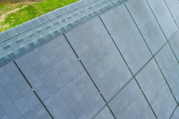 Photovoltaic panels installed on roof of house to generate renewable energy