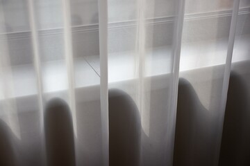 Window curtain in a plain hotel room