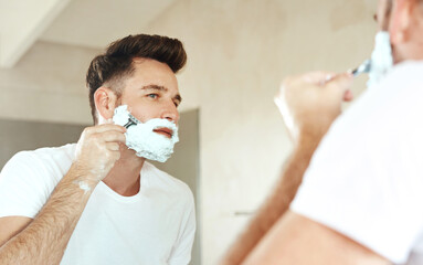 Man, mirror and shaving cream on face in bathroom for grooming, skincare or morning routine....