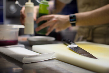 person preparing food in kitchen
