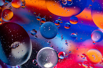 Fototapeta premium Colorful oil drops floating on the water. holiday postcard background.