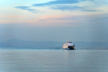 Catamaran passenger ferry in the open sea.