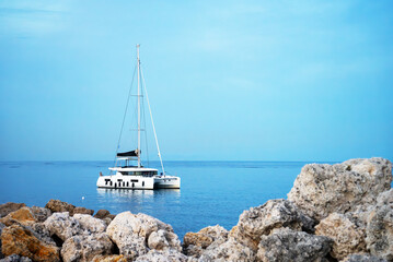 Yacht catamaran sailboat in the blue sea.