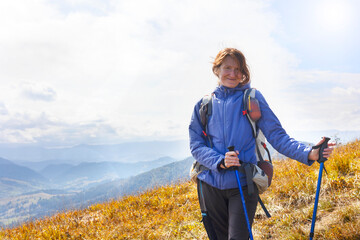girl tourist on the background of a mountain landscape