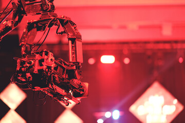 TV camera on a crane at a football match or concert. Close-up live video broadcast camera