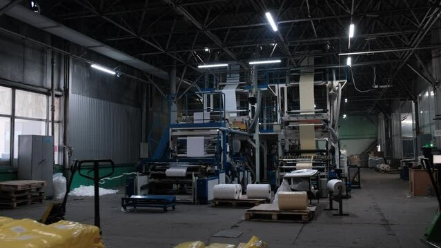 Modern factory for the production of Bags. The operation of automatic plastic bag production machine. Polyethylene production process.