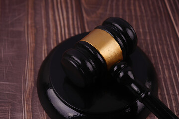 Law and justice concept. A gavel placed on a wooden table.