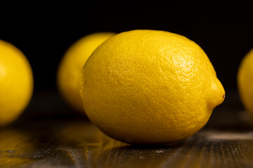 ripe lemon on a black background