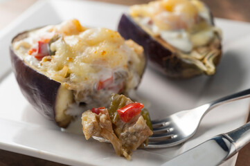 eggplant cut and gratin stuffed with vegetables and tuna