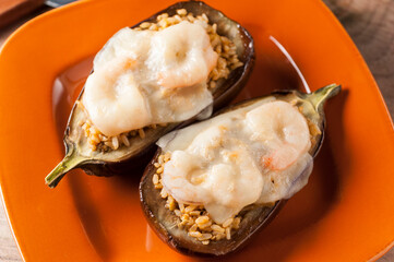 Gratin aubergines and stuffed with brown rice and prawns