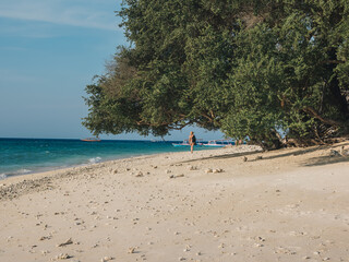 Lonely Person Walking on a Serene Beach Scene on Gili Meno Island, Indonesia