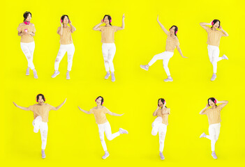 Collection full length joyful asian woman lifestyle in casual outfit dancing on isolated on blue background. Young Asian woman happy smile in studio.