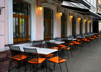 Old street with tables of cafe in center of Moscow in Russia. Cozy cityscape in Moscow....