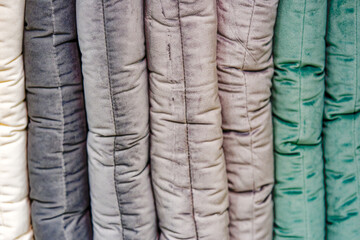 Close-up of pillows in different colors inside of apartment store at Swiss town. Photo taken May 8th, 2024, Zurich, Switzerland.