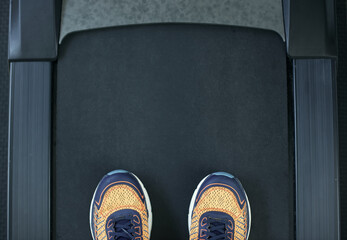 Close up running shoe on the electric treadmill in fitness