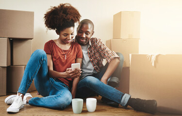 Couple, moving and relax in home with phone to search property, app and reading mortgage info....