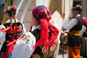 People in traditional Polish folk costumes at Łowicz Corpus Christi procession