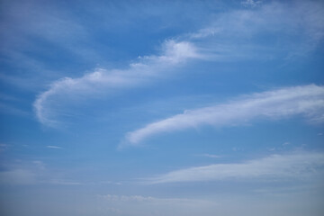 Cloudy haze in the blue sky, heavenly haze in the sky, a ridge of clouds in the sky