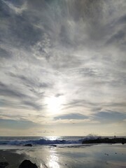 The ocean shore in Bali, clouds in the blue sky, sunny clear day, Bali, Indonesia