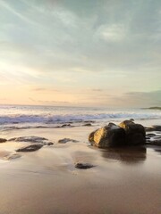 Yellow-orange sunset and sunrise on the ocean shore, Bali island. Epic sunrise, sandy beach. Landscape of Indonesia
