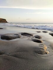 Yellow-orange sunset and sunrise on the ocean shore, Bali island. Epic sunrise, sandy beach. Landscape of Indonesia