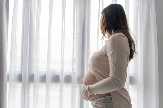 worried pregnant woman concerned and anxious woman in pregnancy overthinking worrying about pregnancy problem Pregnancy depression Mental health - Powered by Adobe