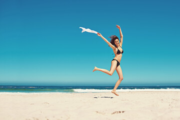 Woman, portrait and bikini or ocean jump for holiday freedom on tropical island, beach or...