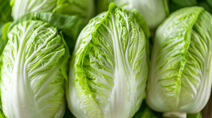 Fototapeta premium Fresh green Chinese cabbage Napa cabbage close-up, ideal for healthy eating, vegetarian recipes, and Asian cuisine-related concepts
