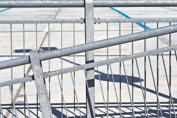Metal railing composed of pre-made sections, crafted off-site, and treated with a protective zinc...