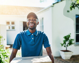 Portrait, outdoor and black man with box, service and sunshine with courier, logistics and...