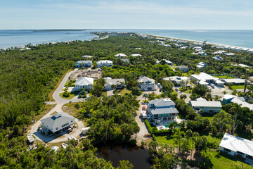 Wealthy neighborhood in small town Boca Grande, Florida with expensive waterfront houses between...