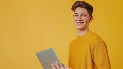 Young Man Holding a Laptop
