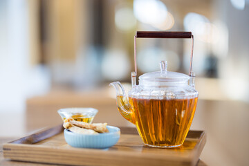 Glass of tea pot and the snack in cafe shop