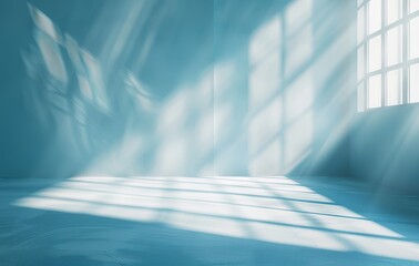 An empty blue room with patterned shadows cast by sunlight through window panes, evoking feelings of calmness and introspection