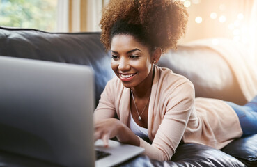 Black woman, laptop and home couch or online shopping as subscription in lounge, streaming or...