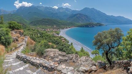  Beach, mountains, and body of water from rocky hilltop