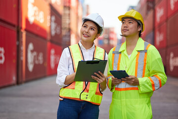 workers or engineers talking about work or project in containers warehouse storage