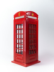 The red telephone box in white background