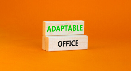 Adaptable office symbol. Concept words Adaptable office on beautiful wooden block. Beautiful orange paper background. Business Adaptable office concept. Copy space.