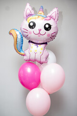 pink cat balloons and pink foil 