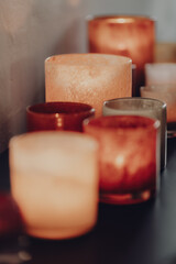 Various glass candle holders in different colors