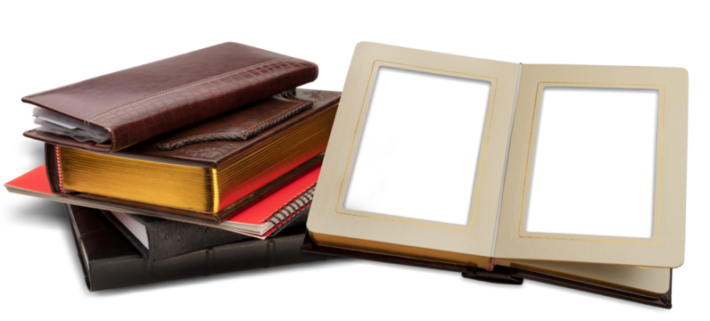 Stack of photo albums, business card holder and red spiral bound brochure isolated on a transparent background