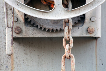 gear wheel industrial cogwheel and chain white painted metal locomotive railroad transport detail closeup