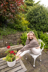 Woman in yoga clothes in a garden