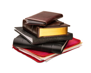 Stack of photo albums, business card holder, red spiral bound brochure and red plastic folder with paper documents isolated on a transparent background