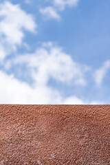polyurethane foam wall texture with blur blue open sky background. - obrazy, fototapety, plakaty