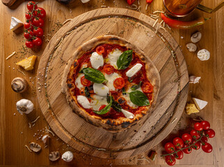 Delicious pizza surrounded by fresh ingredients