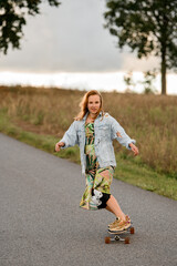 Fototapeta premium Beauty in motion: young girl's longboard journey viewed.